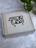 Box With Sorry sticker
